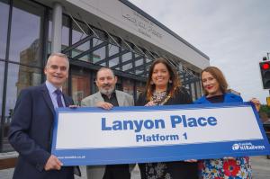 Image shows Imtac Chair Max O'Brien with the Lord Mayor and representatives of Translink and DfI outside Lanyon Place